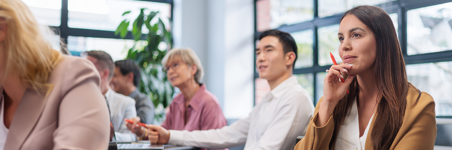Professionals listening attentively in a modern office