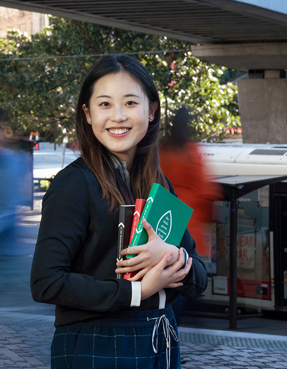 Woman holding books